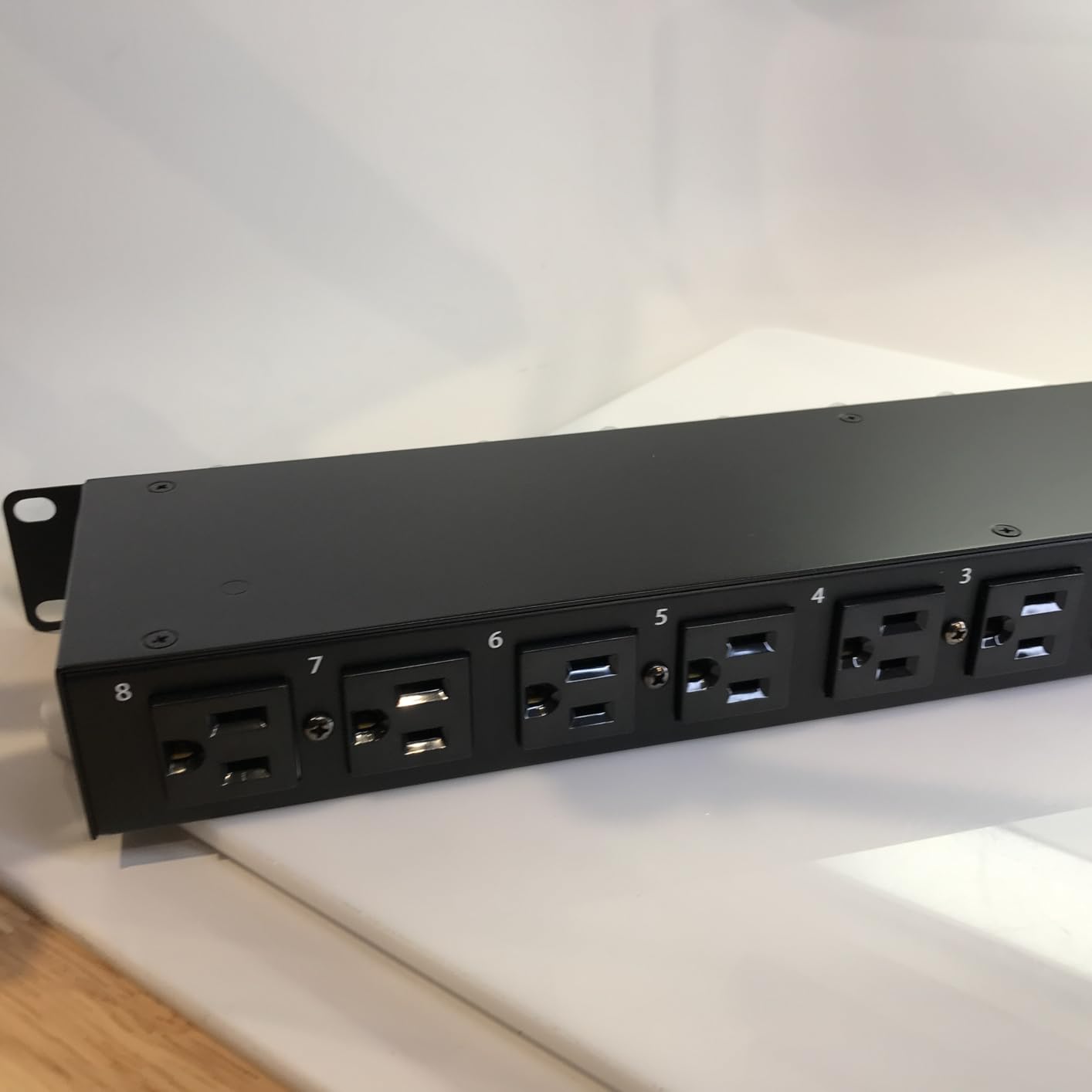 StarTech 8-Outlet 1U Switched PDU, 15A, TAA, 125V (8NS8-RACK-MOUNT-PDU) | Horizontal rack mount power strip, Outlet on/off switches, 15A breaker, 8ft/2.4m cord, NEMA 5-15, Illuminated rockers customer photo 1