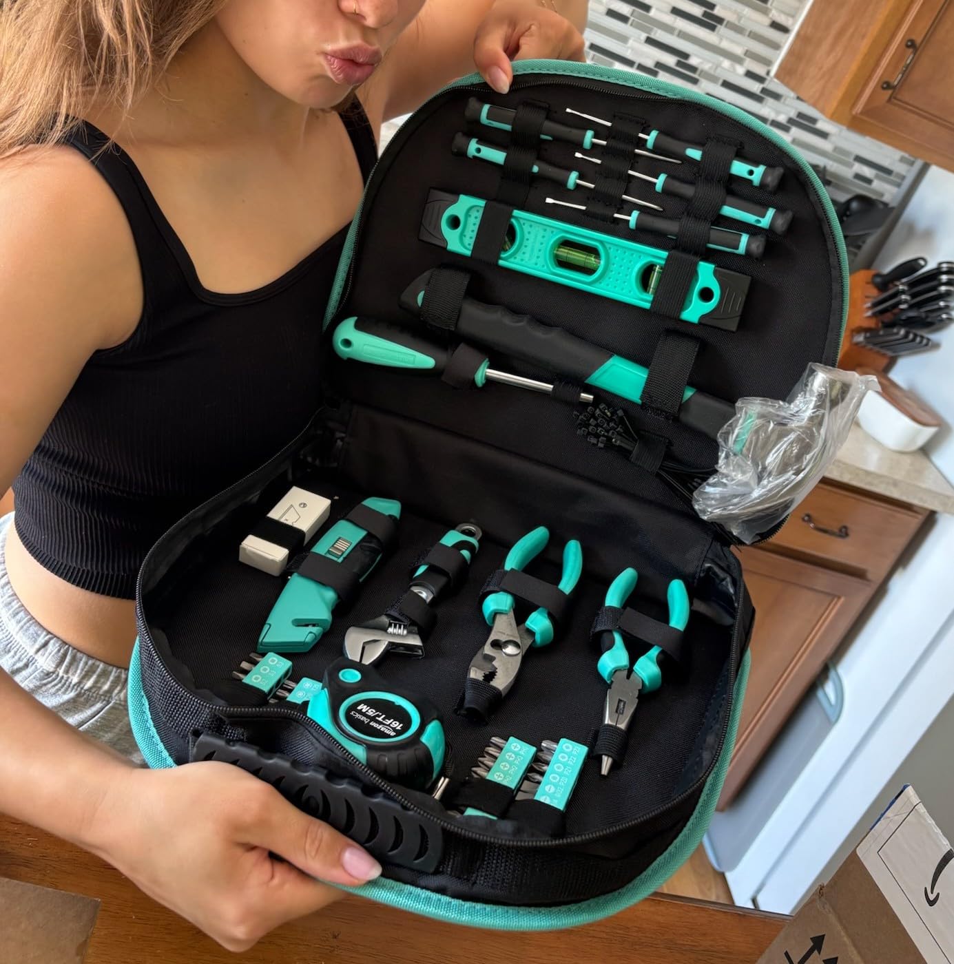 Amazon Basics 104-Piece Home Repair Household Tool Set with Easy Carrying Round Pouch, Portable Hand Tool Kit, Turquoise, 14.4 x 11.4 x 3 inches customer photo 2