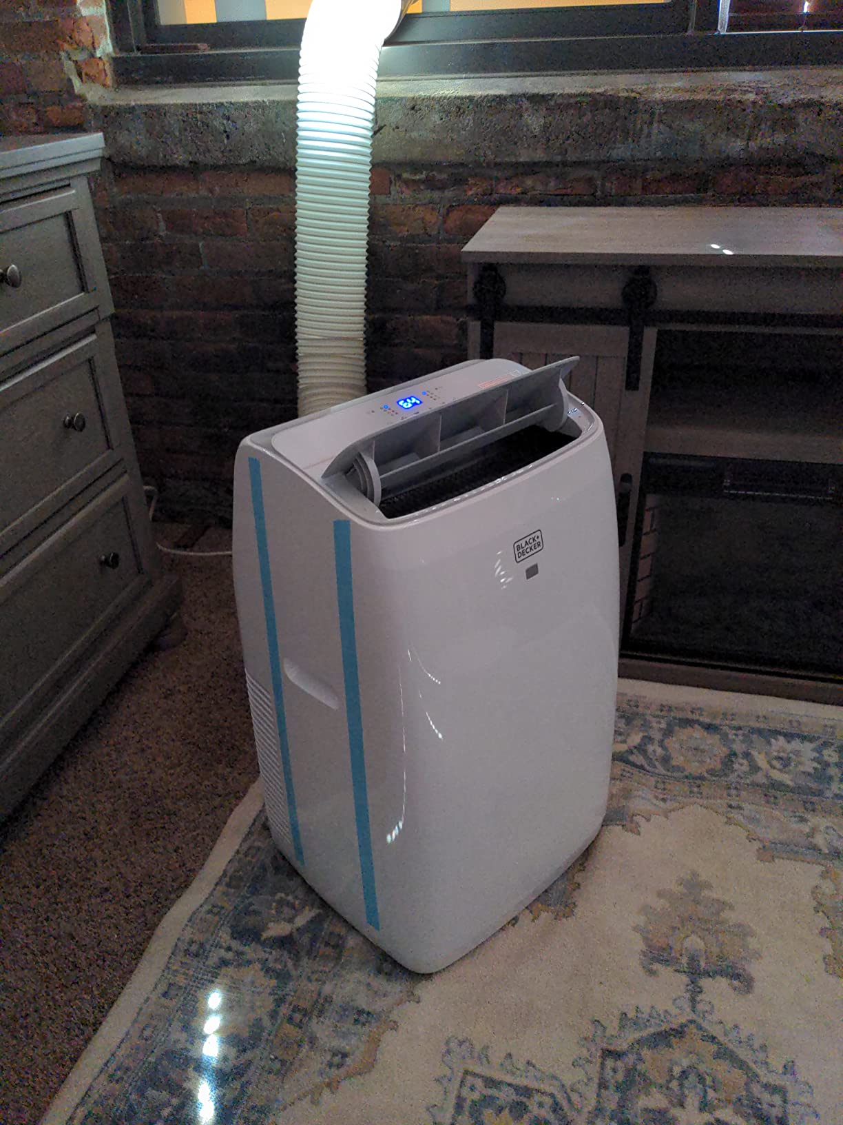 BLACK+DECKER Portable Air Conditioner with Heat, 14,000 BTU with 12,000 BTU Heating for Rooms Up To 700 Sq. Ft., Portable AC with Follow Me Remote Control, BPT10HWTB, White customer photo 1