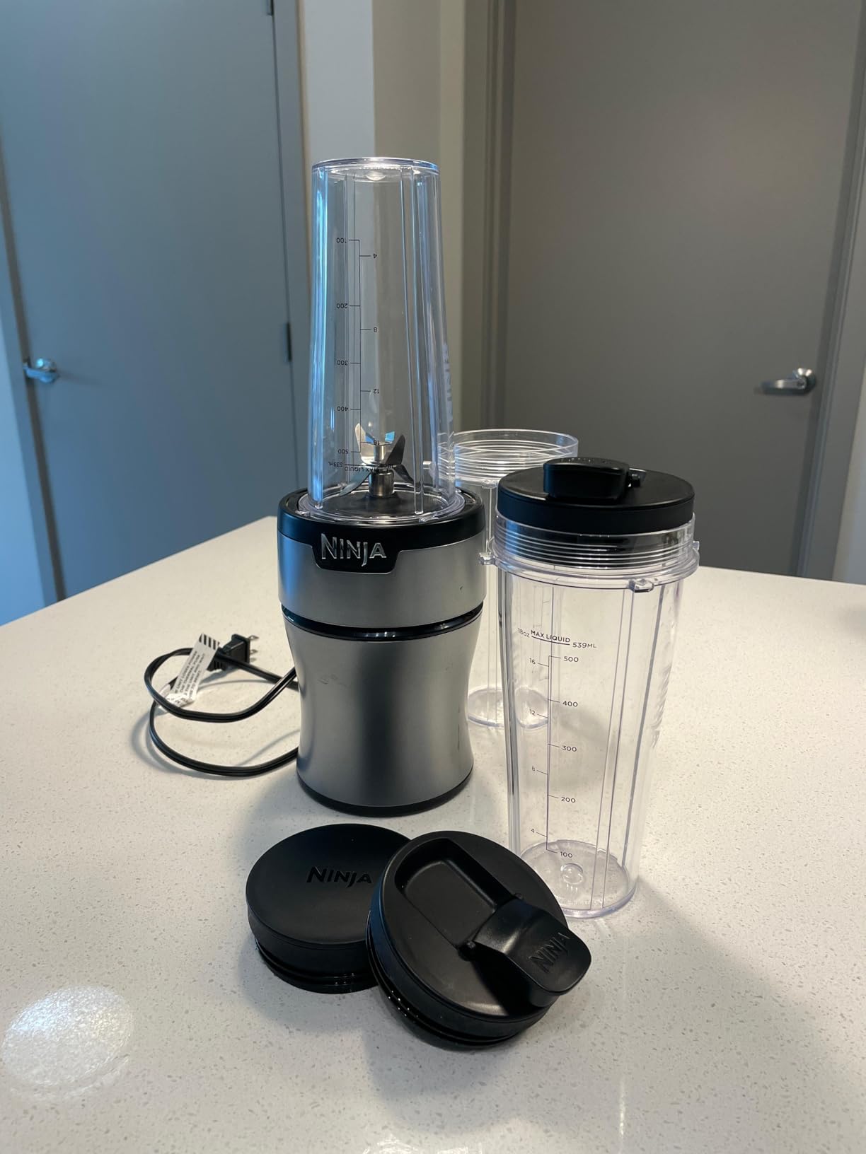 Ninja Nutri-Plus Personal Blender, 900PW, (3) 20oz Cups, Silver, BN301 | 900-peak-watt push-to-blend motor for smoothies & sauces. (3) 20-oz cups, 2 spout lids & storage lid. Dishwasher safe. customer photo 2