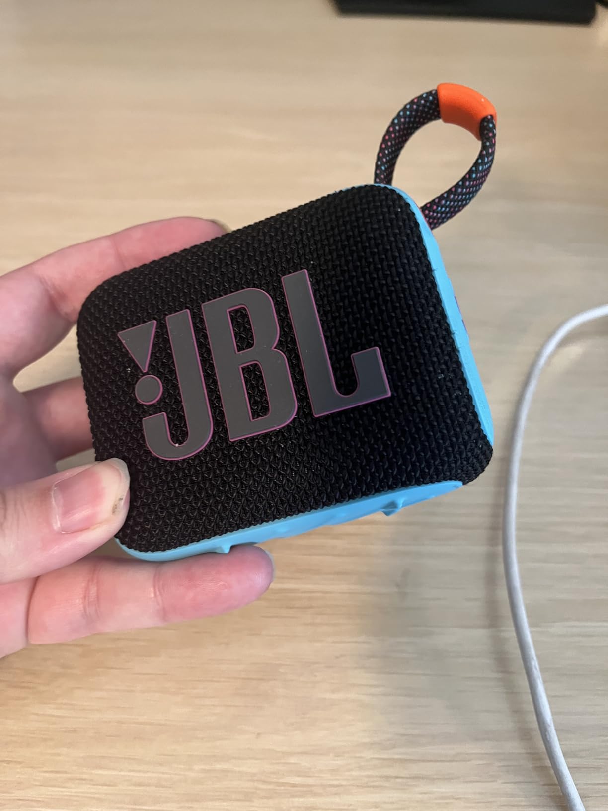 JBL Go 4 - Ultra-Portable, Waterproof and Dustproof Bluetooth Speaker, Big JBL Pro Sound with Punchy bass, 7-Hour Built-in Battery, Made in Part with Recycled Materials (White) customer photo 1